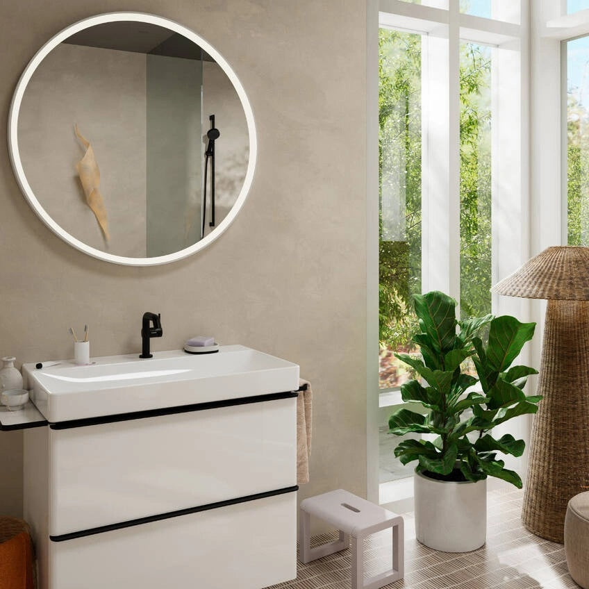 Смесител за мивка Axor Tecturis S 110 Fine - черен мат монтиран върху бяла мивка в модерен банен интериор KERANOVA