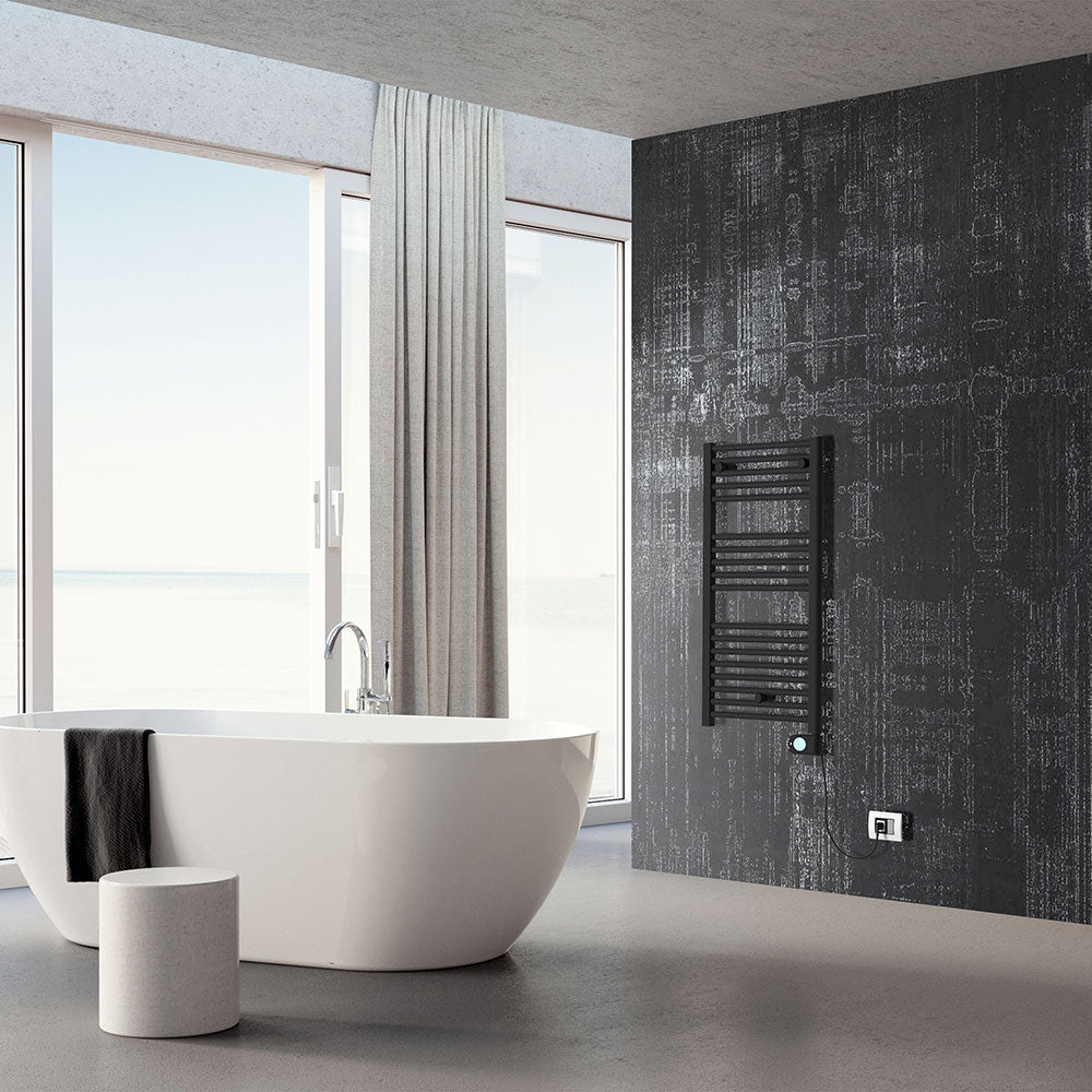 Електрическа лира Crystal E-Jade Matt Black 40x72 и 48x92 см. на стената в модерен баня интериор от KERANOVA