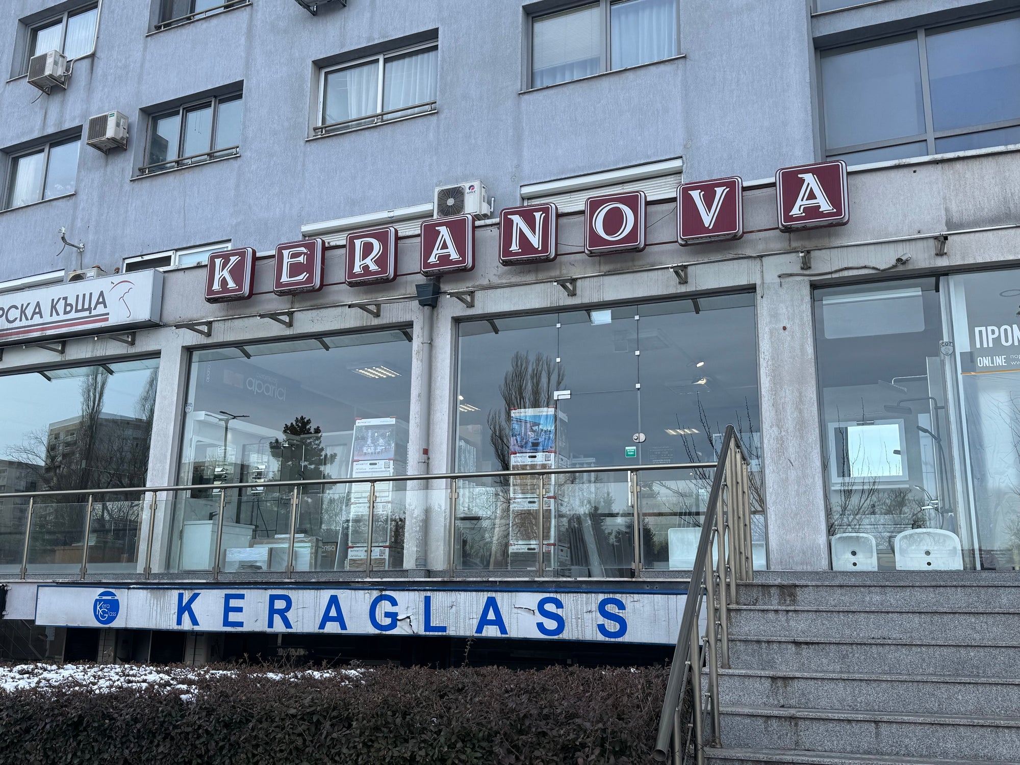 Storefront of Keranova with large signage and glass windows, featuring Keraglass branding and modern architecture.